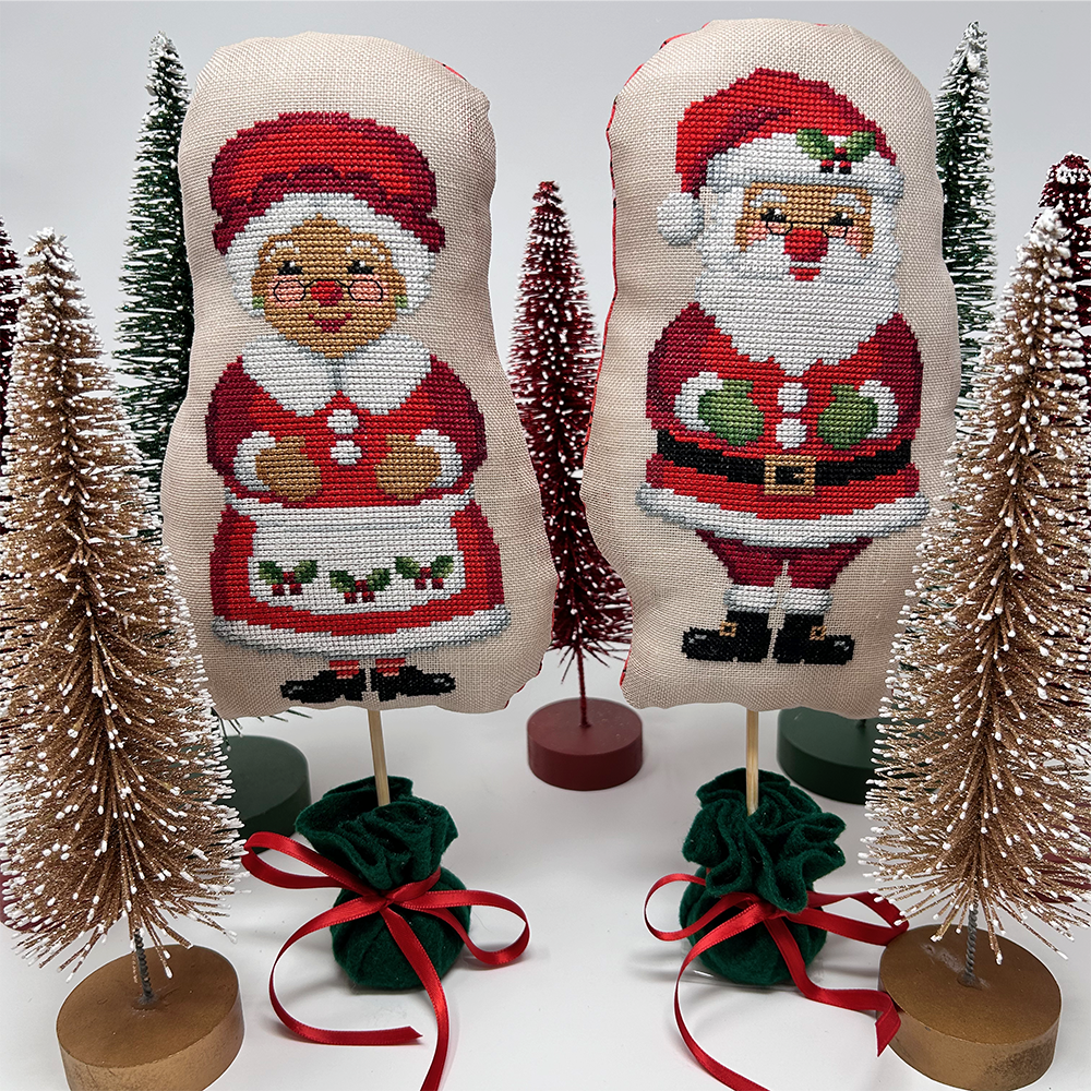 Santa and Mrs clause on sticks