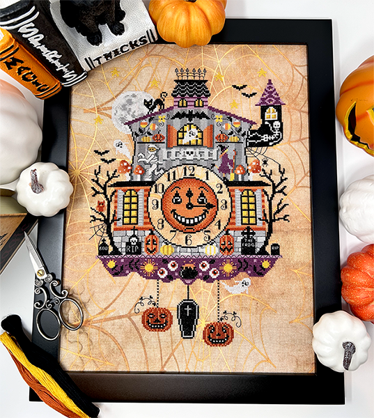 Halloween clock with monsters, dead trees and tombstones