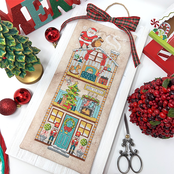 Santa on roof of house with child sleeping