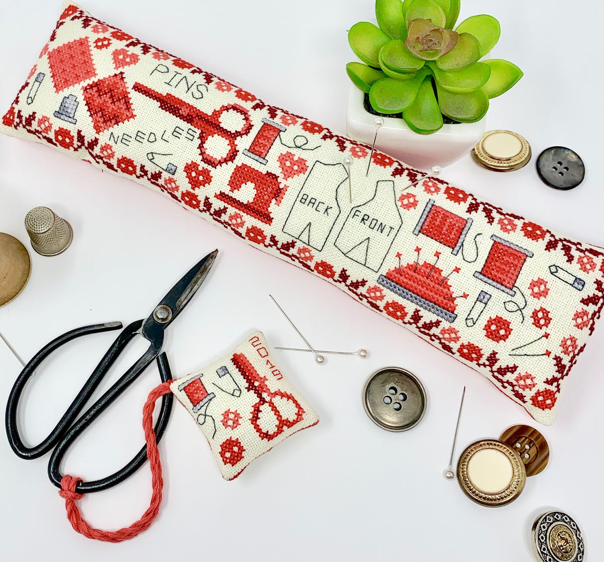 Vintage red sewing motifs and button border