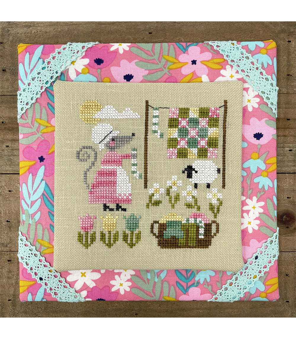 mouse hanging laundry in spring