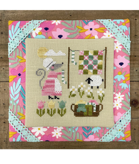 mouse hanging laundry in spring