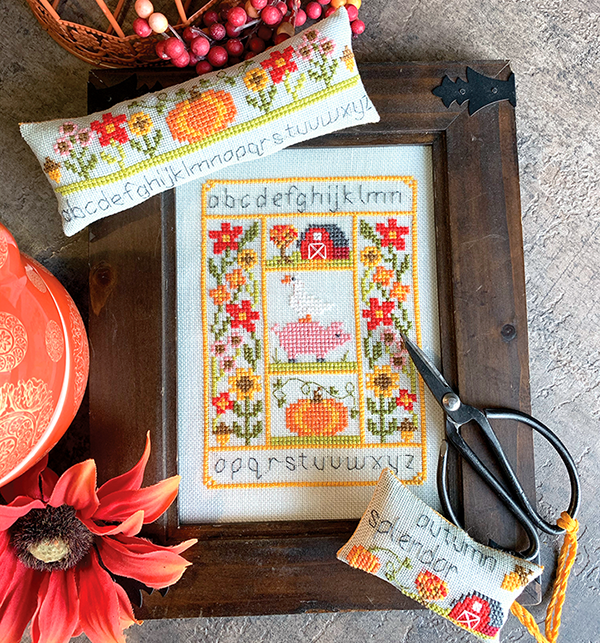 Autumn farm with big and pumpkin and barn