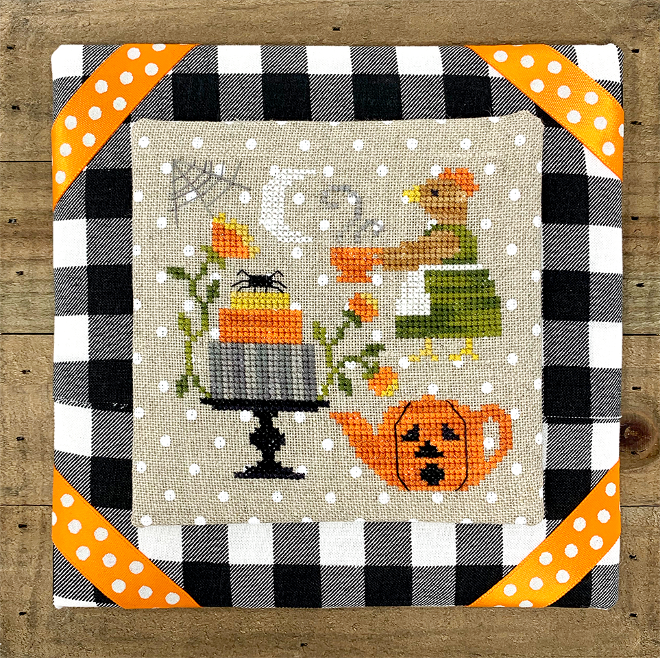 Chicken in dress with tea and Halloween cake