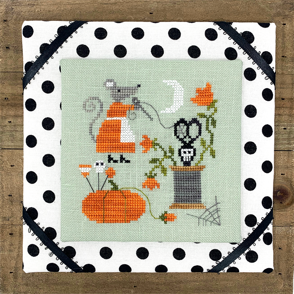 Mouse with pumpkin pin cushion thread and skull scissors