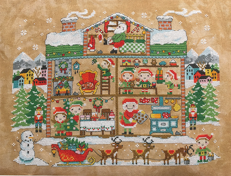 Santa’s house with trees and elves