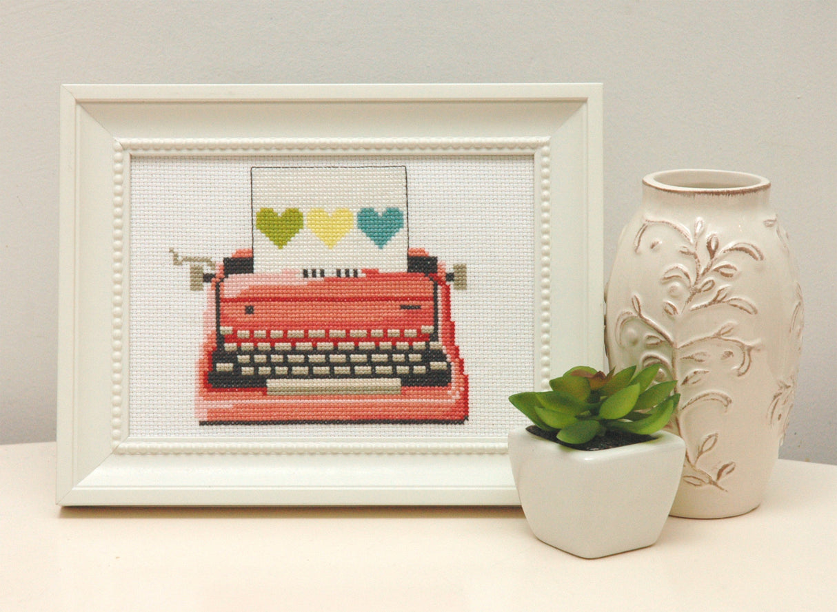 Vintage pink typewriter with hearts