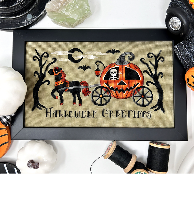 Pumpkin carriage pulled by black horse with skeleton inside