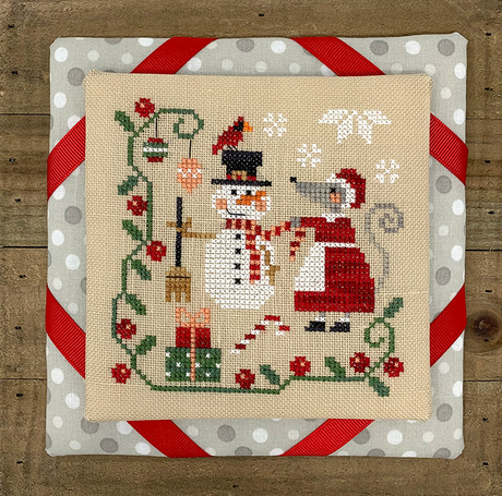 Mouse building a snowman