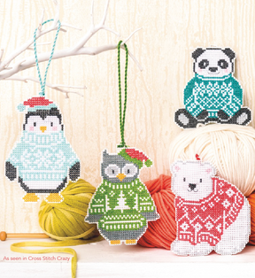 Penguin owl panda and polar bear in sweaters