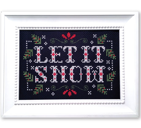 Christmas greenery with text let it snow