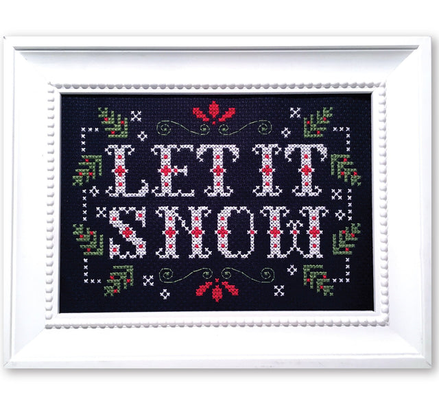 Christmas greenery with text let it snow
