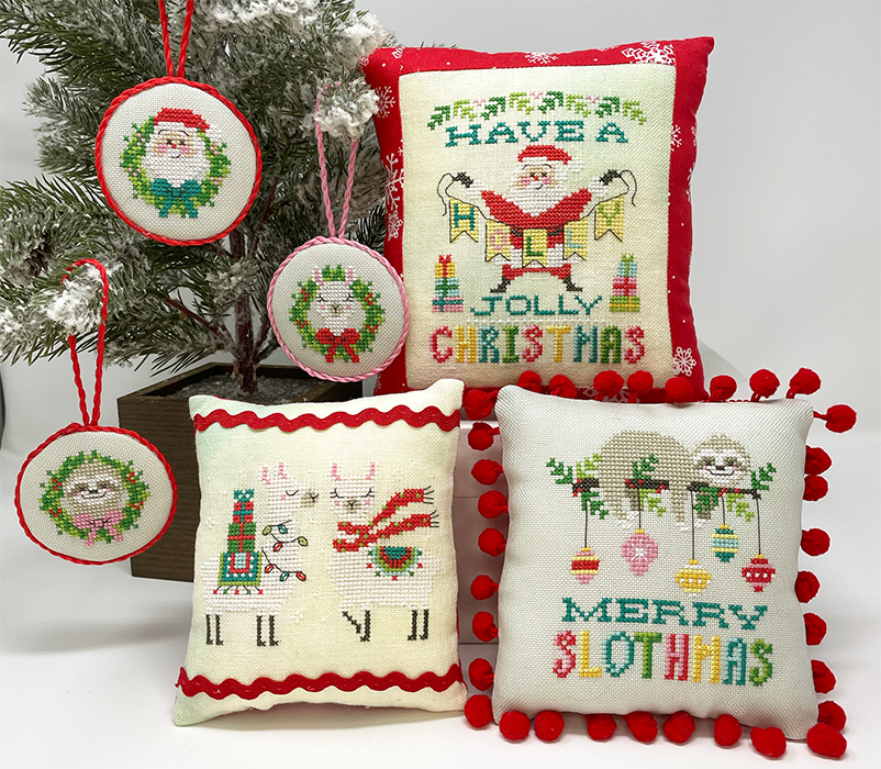 Santa with banner sloth with ornaments and llama with presents and scarves