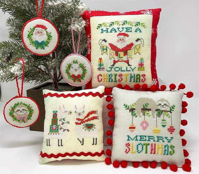 Santa with banner sloth with ornaments and llama with presents and scarves