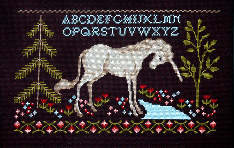 Unicorn in forest by river