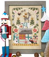 Christmas snow globe on presents with animals and festive greenery