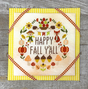 Fall motifs with scarecrow and fox with the words happy fall y’all