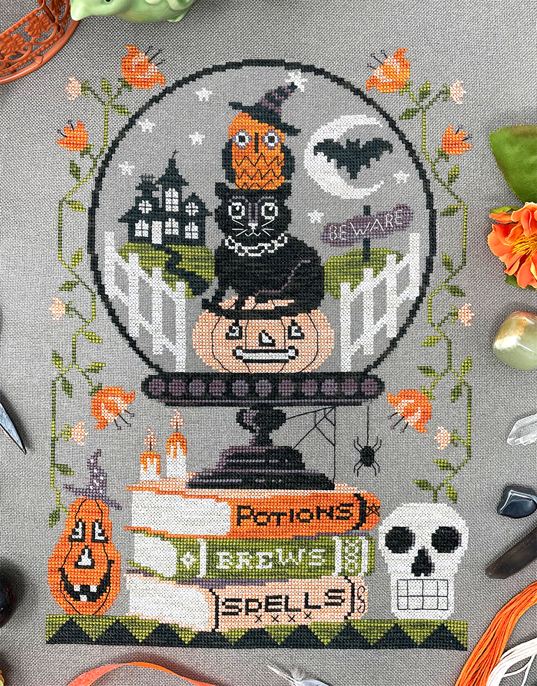 Halloween crystal ball with animals pumpkins and skull