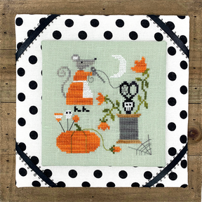 Mouse with pumpkin pin cushion thread and skull scissors