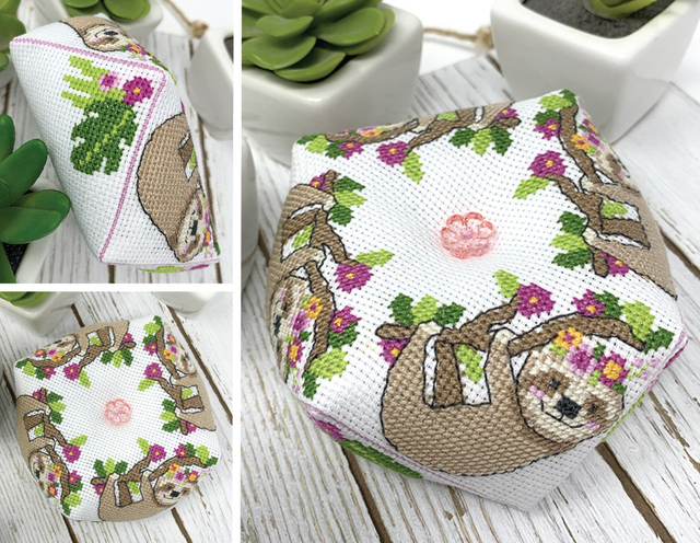 Sloth on branch with flowers