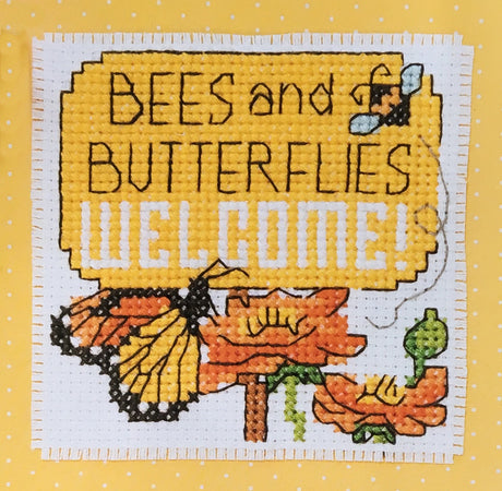 Butterfly on flower with the words bees and butterflies welcome